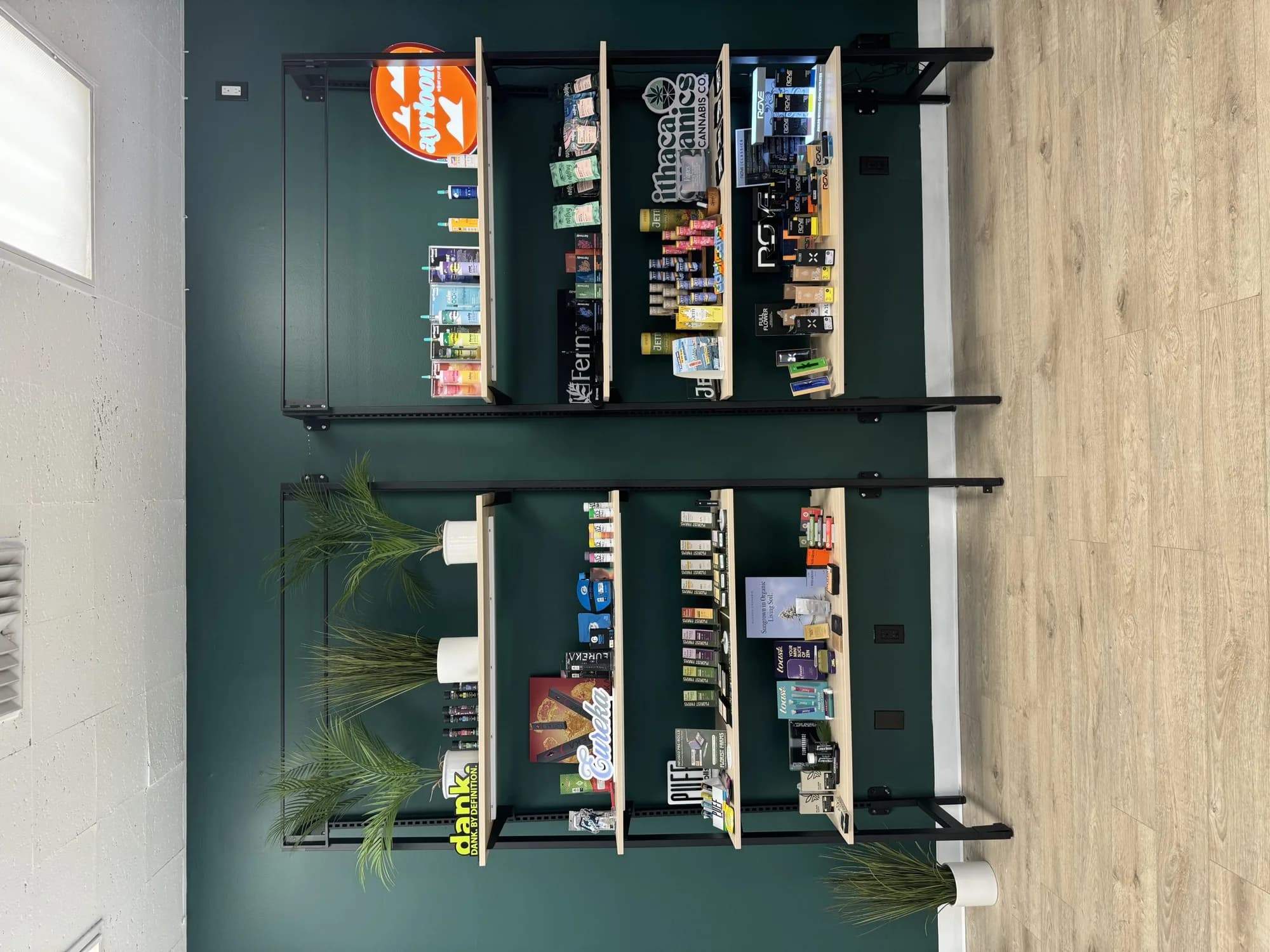 Leafology shelves stocked with Dank, Cookies and MJaunty cannabis edibles and vapes