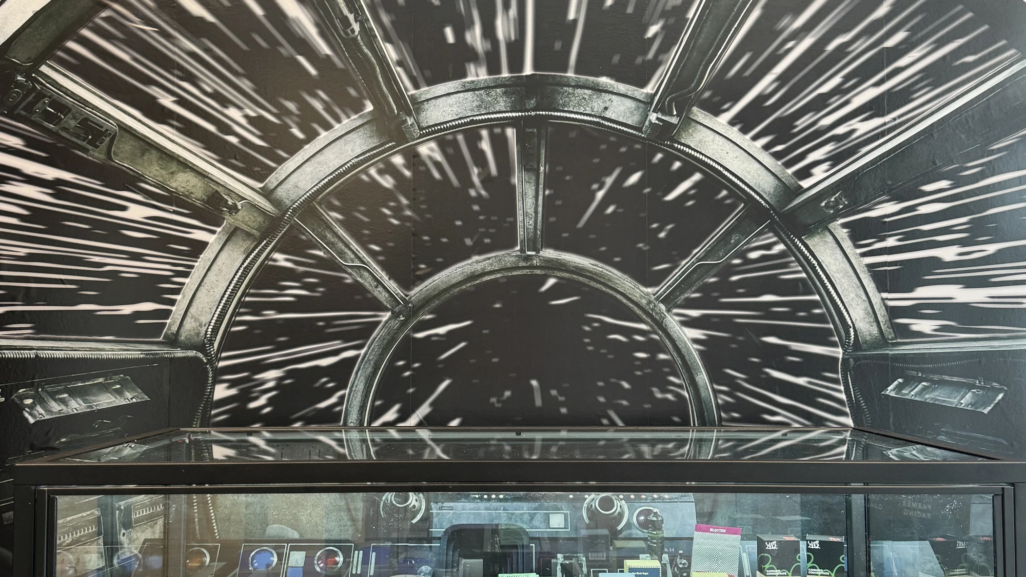 Leafology concentrate case lit under a black-and-white Millennium Falcon hyperdrive backdrop