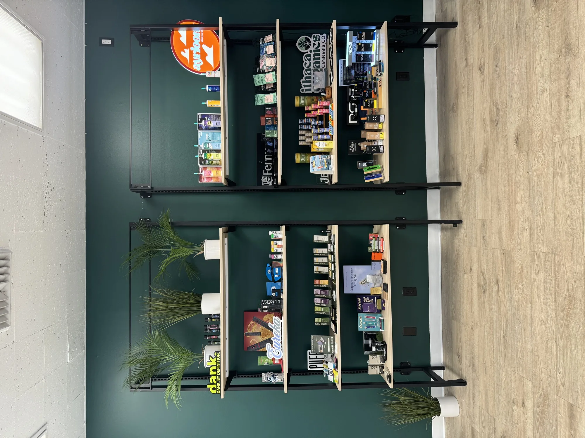 Leafology shelves stocked with Dank, Cookies and MJaunty cannabis edibles and vapes